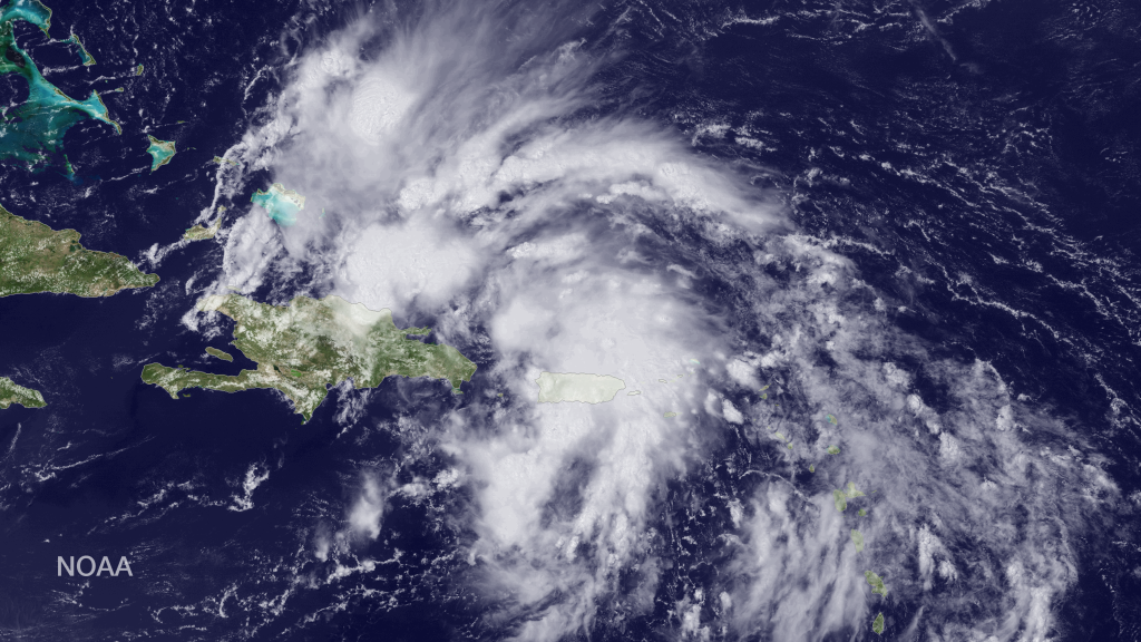A satellite photograph from NOAA shows Invest 96L in the northern caribbean isalnds.